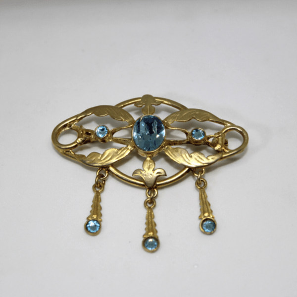 Spilla sa broscia, con strass celesti, argento dorato Gioielleria Mele