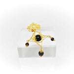 Amuleto spilla su Kokko, in filigrana sarda, onice e corallo Gioielleria Mele